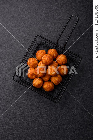 Delicious crispy balls breaded with mozzarella cheese, salt and spices 117139900