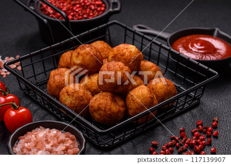Delicious crispy balls breaded with mozzarella cheese, salt and spices Delicious crispy balls breaded with mozzarella cheese, salt and spices 117139907