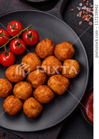 Delicious crispy balls breaded with mozzarella cheese, salt and spices 117139942