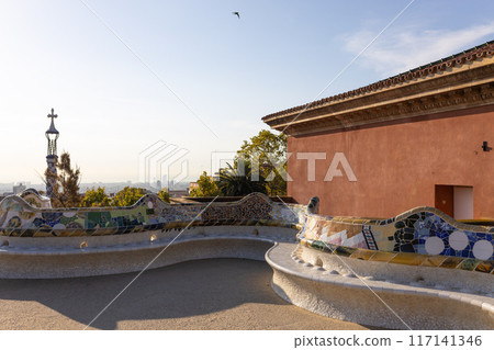 Serpent bench made of mosaic tiles in Park Guell in Barcelona. UNESCO World Heritage Site. Concept of travel, tourism and vacation 117141346