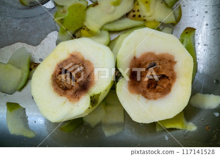 Rotten apple looking very good from outside but it is rotten from the inside Rotten apple looking very good from outside but it is rotten from the inside 117141528