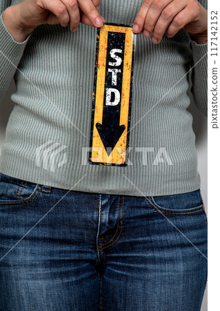 STD sexually transmitted diseases. Pointing arrow with text. Women's health and wellness concept 117142152