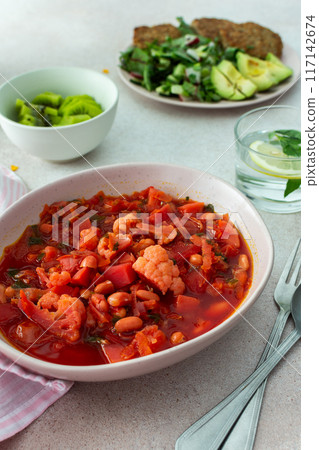 Red soup with beet, vegetables and cauliflower, chickpea cutlets and mixed salad 117142674