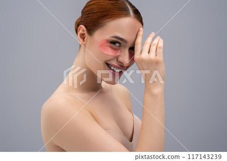 Portrait of a pretty young woman with moisturizing patches under her eyes 117143239