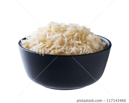 sauerkraut in a black ceramic bowl isolated on white background. Clipping path. sauerkraut in a black ceramic bowl isolated on white background. Clipping path. 117143466