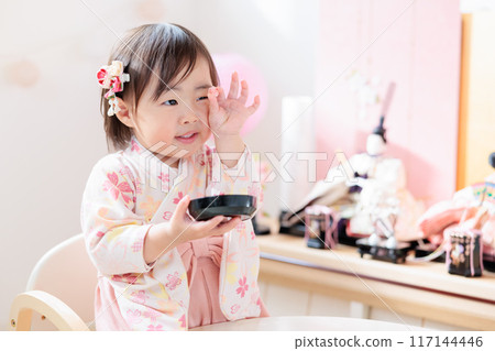 Infant (1 year old) eating Hina Arare Infant (1 year old) eating Hina Arare 117144446