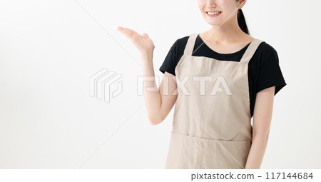 A lady with an apron in order to show off 117144684
