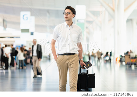 Men walking in the airport Men walking in the airport 117145962