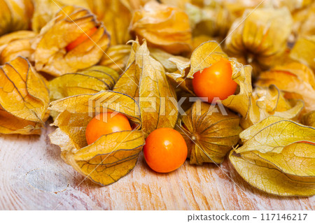 Cape gooseberry physalis on wooden background Cape gooseberry physalis on wooden background 117146217