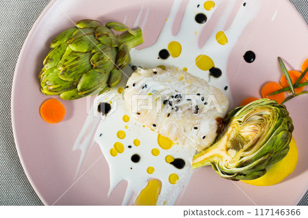 Deliciously fillet of fried horse-mackerel with sauce and artichokes 117146366