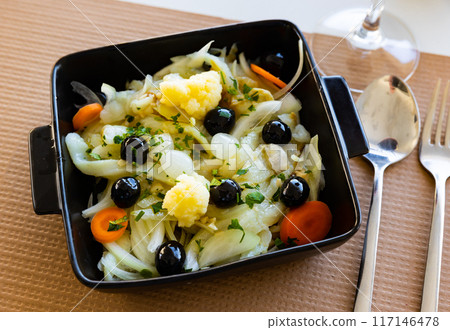 Salad of codfish with marinated onions, cauliflower, carrots and olives Salad of codfish with marinated onions, cauliflower, carrots and olives 117146478