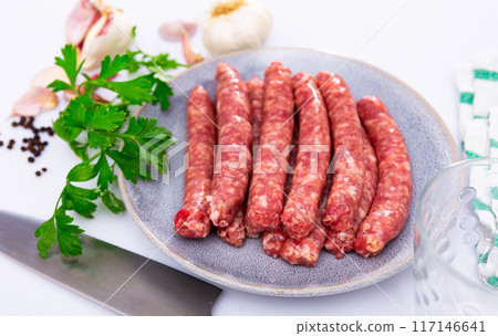Raw sausages longaniza ready for frying Raw sausages longaniza ready for frying 117146641