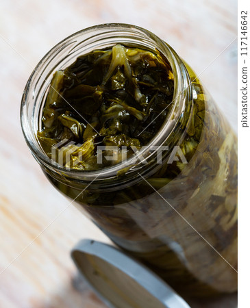 Marinated chard in glass jar 117146642