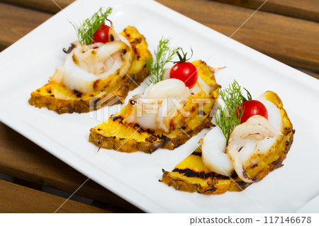 Plate with Cuttlefish grilled with pineapple Plate with Cuttlefish grilled with pineapple 117146678