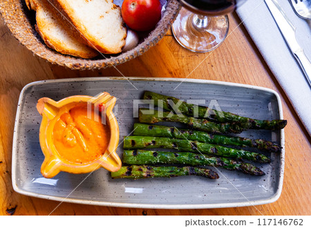 Asparagus dish with Romesco sauce 117146762
