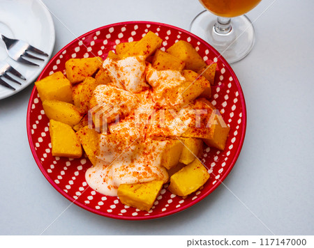 Baked potatoes Patatas bravas with sauce aioli and paprika Baked potatoes Patatas bravas with sauce aioli and paprika 117147000