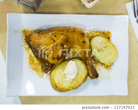 Baked chicken legs with potatoes Baked chicken legs with potatoes 117147015