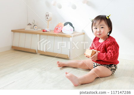 Demon eating lucky beans (sweets) Infant (1 year old) Demon eating lucky beans (sweets) Infant (1 year old) 117147286