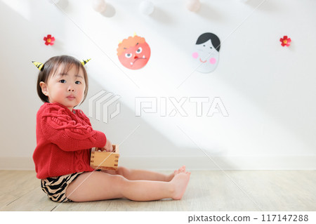 Demon eating lucky beans (sweets) Infant (1 year old) Demon eating lucky beans (sweets) Infant (1 year old) 117147288