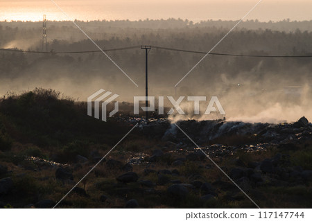 Misty morning atmosphere in Pekosong village, Lombok, Indonesia 117147744
