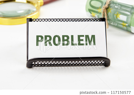 PROBLEM text on a business card in a composition with Euro banknotes and a magnifying glass out of focus PROBLEM text on a business card in a composition with Euro banknotes and a magnifying glass out of focus 117150577