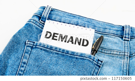 Economy or business concept. The word DEMAND on a notebook on jeans on a white background 117150605
