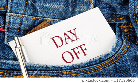 Business and Day off concept. Copy space. DAY OFF symbol on a piece of paper from a jeans pocket 117150606