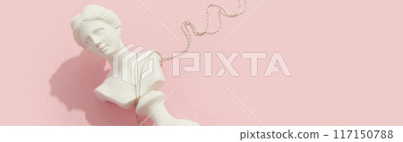 Creative composition with pendant on pink background. Trendy jewelry in minimalist style 117150788