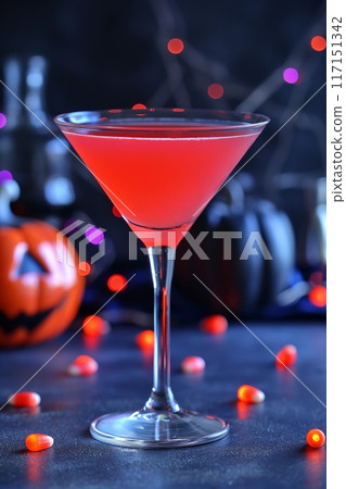 Vibrant red martini in a sleek glass, illuminated by festive lights for a lively party atmosphere Vibrant red martini in a sleek glass, illuminated by festive lights for a lively party atmosphere 117151342