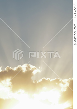 Vertical rays of sunlight coming through the clouds 117152236