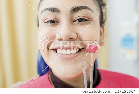 Dental smile young woman with dentist tools. Patient with perfect smile with dental explorer and mirror, Perfect smile of woman with dentist tools, Concept of perfect smile and dental health 117153504