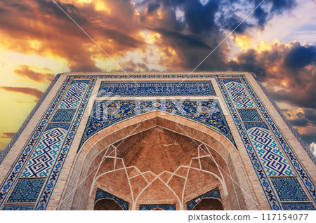 facade portal decorated ceramic tiles with ornament islamic pattern of ancient madrasah Barak Khan. Hazrati Imam Architectural Complex in Tashkent, Uzbekistan 117154077