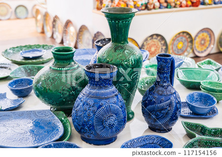 Uzbek handmade ceramic vases and jug with in pottery workshop in Uzbekistan Uzbek handmade ceramic vases and jug with in pottery workshop in Uzbekistan 117154156
