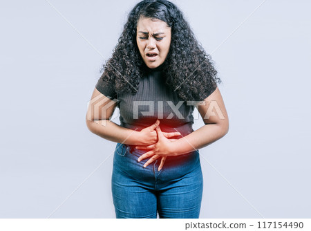 Young woman suffering stomach pain. People with stomach pain isolated, Woman with abdominal pain isolated Young woman suffering stomach pain. People with stomach pain isolated, Woman with abdominal pain isolated 117154490