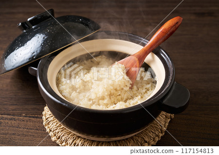 Whole rice cooked in a clay pot Whole rice cooked in a clay pot 117154813