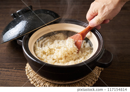 Whole rice cooked in a clay pot Whole rice cooked in a clay pot 117154814