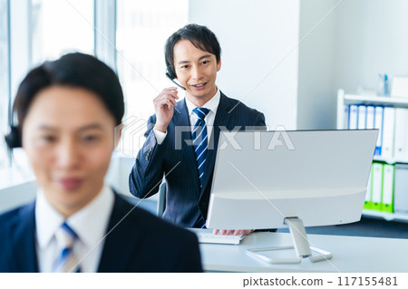 Japanese male operator working in an office 117155481