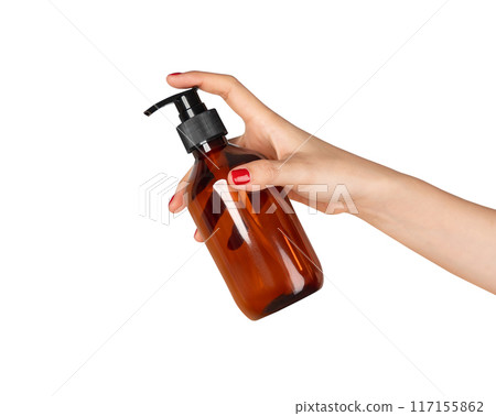 Clipping path, Female hand holding plastic tube product on isolated background. 117155862