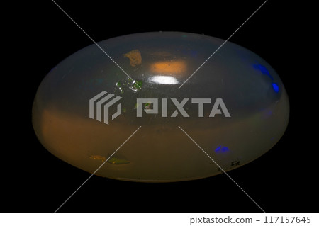 natural rainbow opal gem isolated on black background natural rainbow opal gem isolated on black background 117157645
