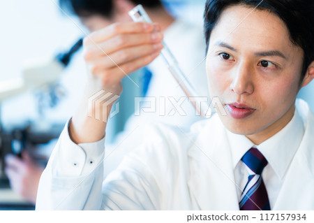 Businessman conducting an experiment Businessman conducting an experiment 117157934