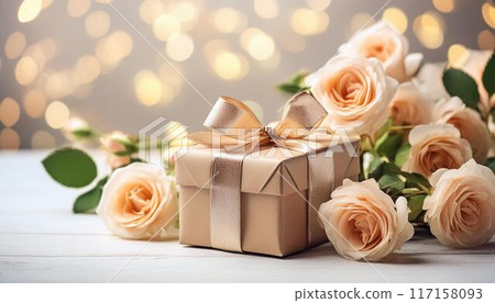 Rose flowers and gift box with ribbon .Greeting card with space for text 117158093