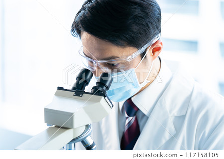 Businessman conducting an experiment 117158105