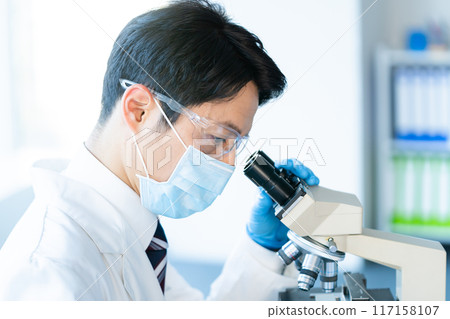 Businessman conducting an experiment 117158107
