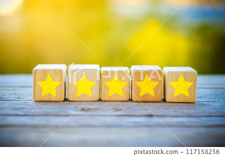 Five Star Rating Excellence Customer Satisfaction Quality Service Top Performance Wooden Blocks Gold Stars Blurred Nature Background Conceptual Image for Business and Services Five Star Rating Excellence Customer Satisfaction Quality Service Top Performance Wooden Blocks Gold Stars Blurred Nature Background Conceptual Image for Business and Services 117158256
