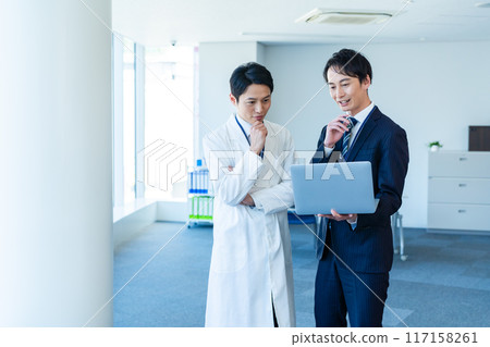 Businessman having a meeting with a doctor Businessman having a meeting with a doctor 117158261