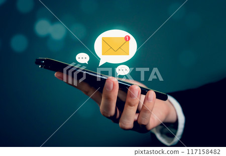 Businessman hand using smartphone and shows a digital screen of new email notifications, messages to deliver. Businessman hand using smartphone and shows a digital screen of new email notifications, messages to deliver. 117158482