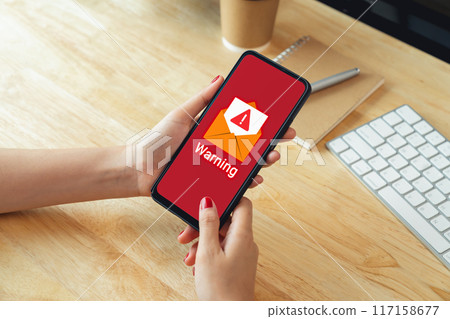 Hand using smartphone with shows a warning screen of new email notifications, hack password and personal data. Concept of cyber crime. 117158677