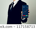 Businessman trader using smartphone with stock market investments and graph on screen to analyze trading data, buy or sell and checking price on mobile application. 117158713