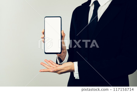 Businessman hands holding smartphone with mockup of blank screen. 117158714