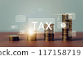 Tax planning concept, The screen displays tax symbols and a pile of gold coins on the table. 117158719